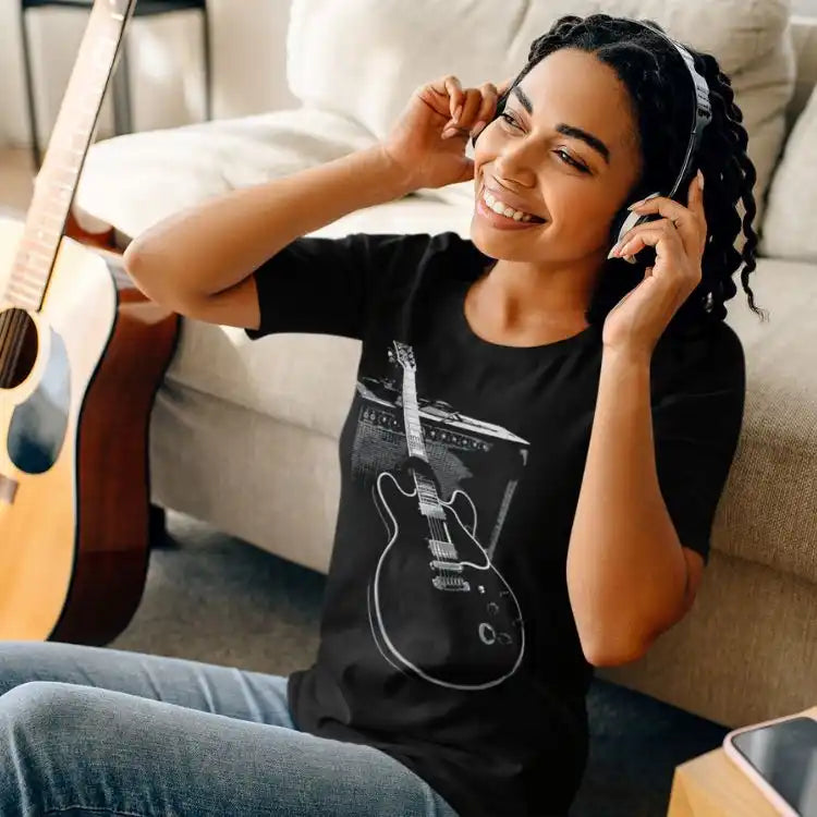 Black t-shirt with guitar graphic.