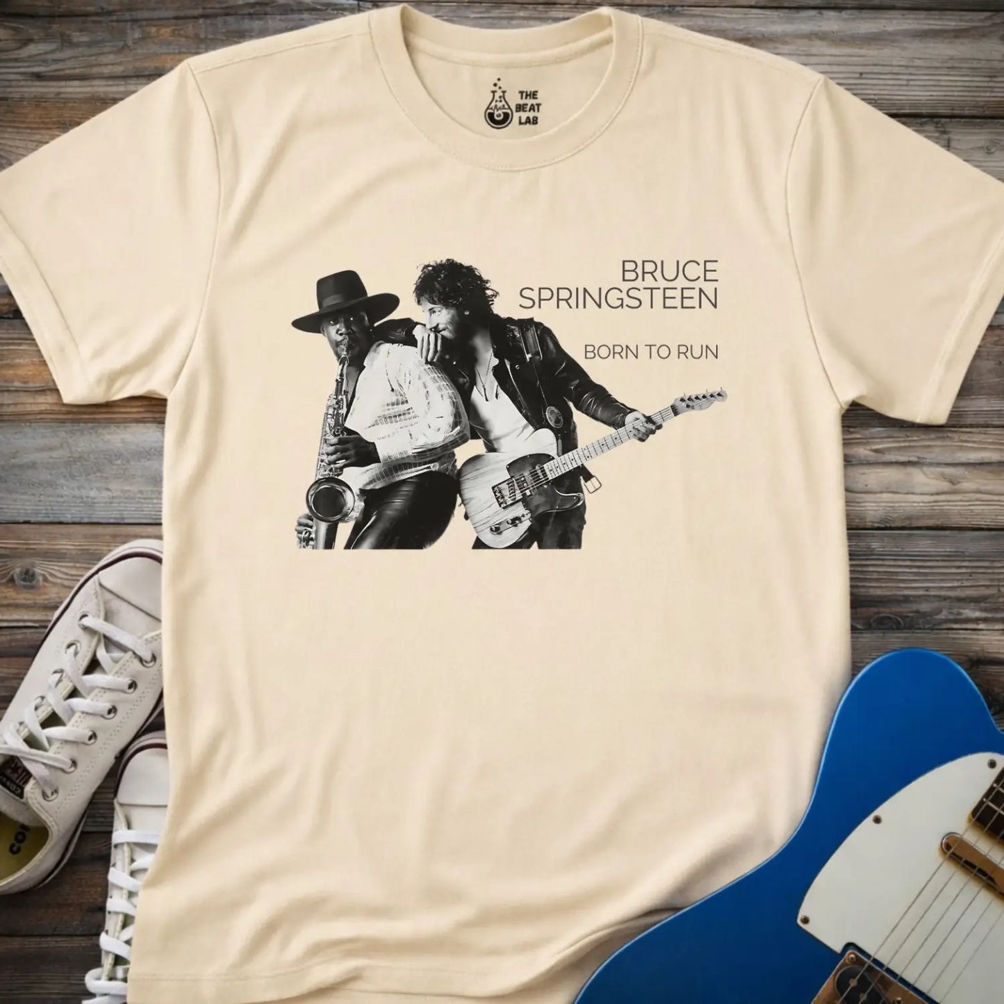 Sand beige color adult unisex gildan 64000 shirt featuring Born to run studio album by e street band bruce springsteen 1975