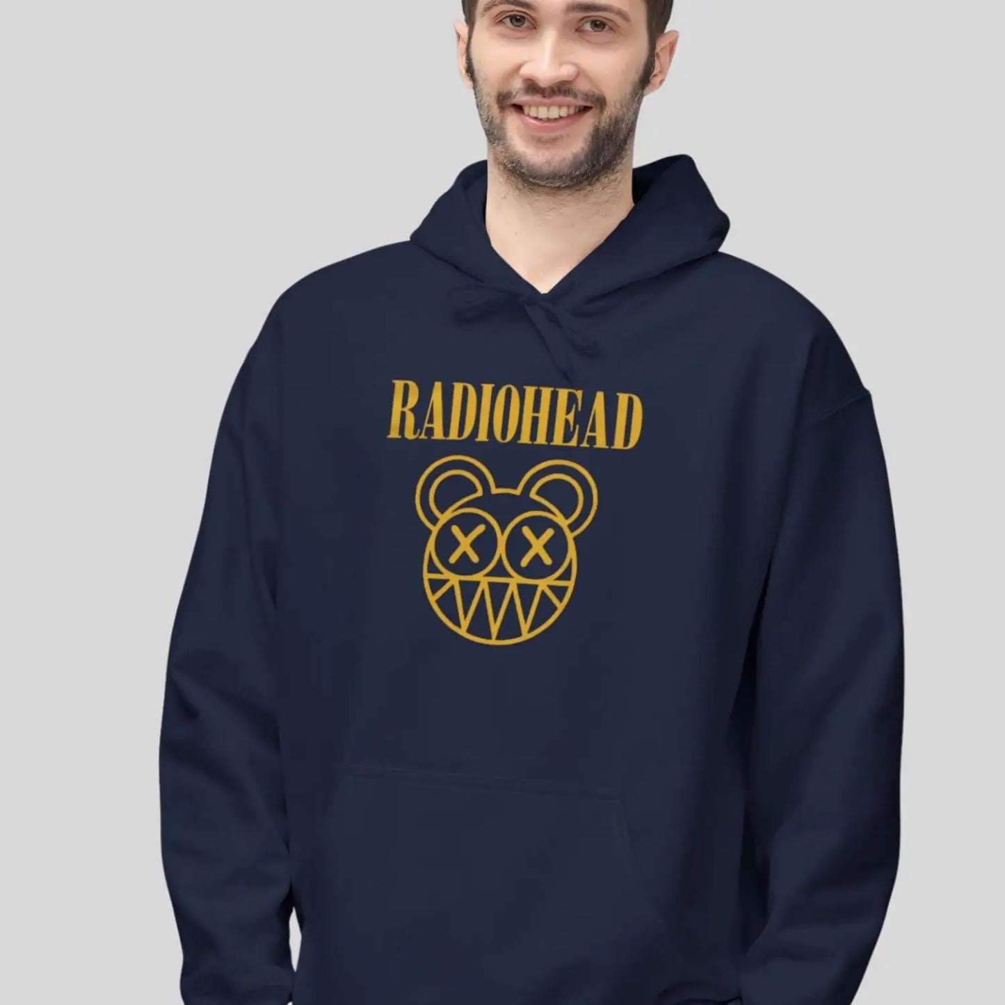 Man wearing navy blue color of adult pullover fleece Gildan hoodie featuring vintage radiohead rock band music logo