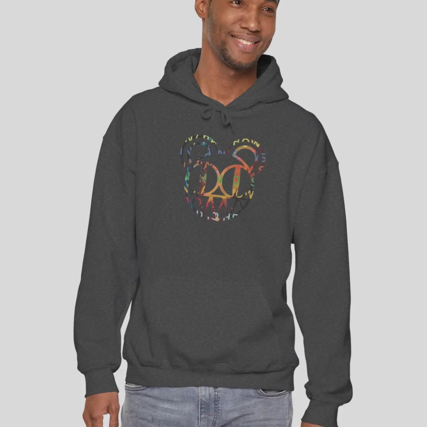 Man Person wearing a dark heather color hoodie of Radiohead bear logo collage with the iconic cartoon bear head combined with colorful album-inspired artwork for rock fans