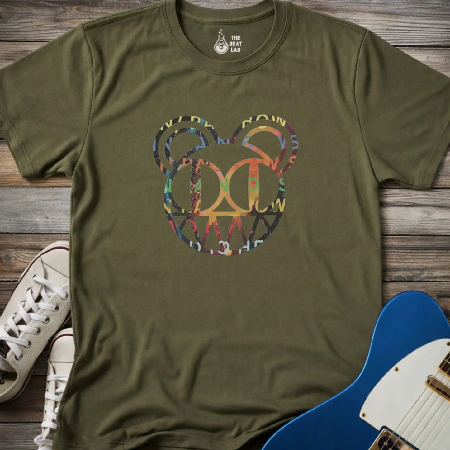 Military green unisex color Radiohead bear logo collage t-shirt with the iconic cartoon bear head combined with colorful album-inspired artwork for rock fans.
