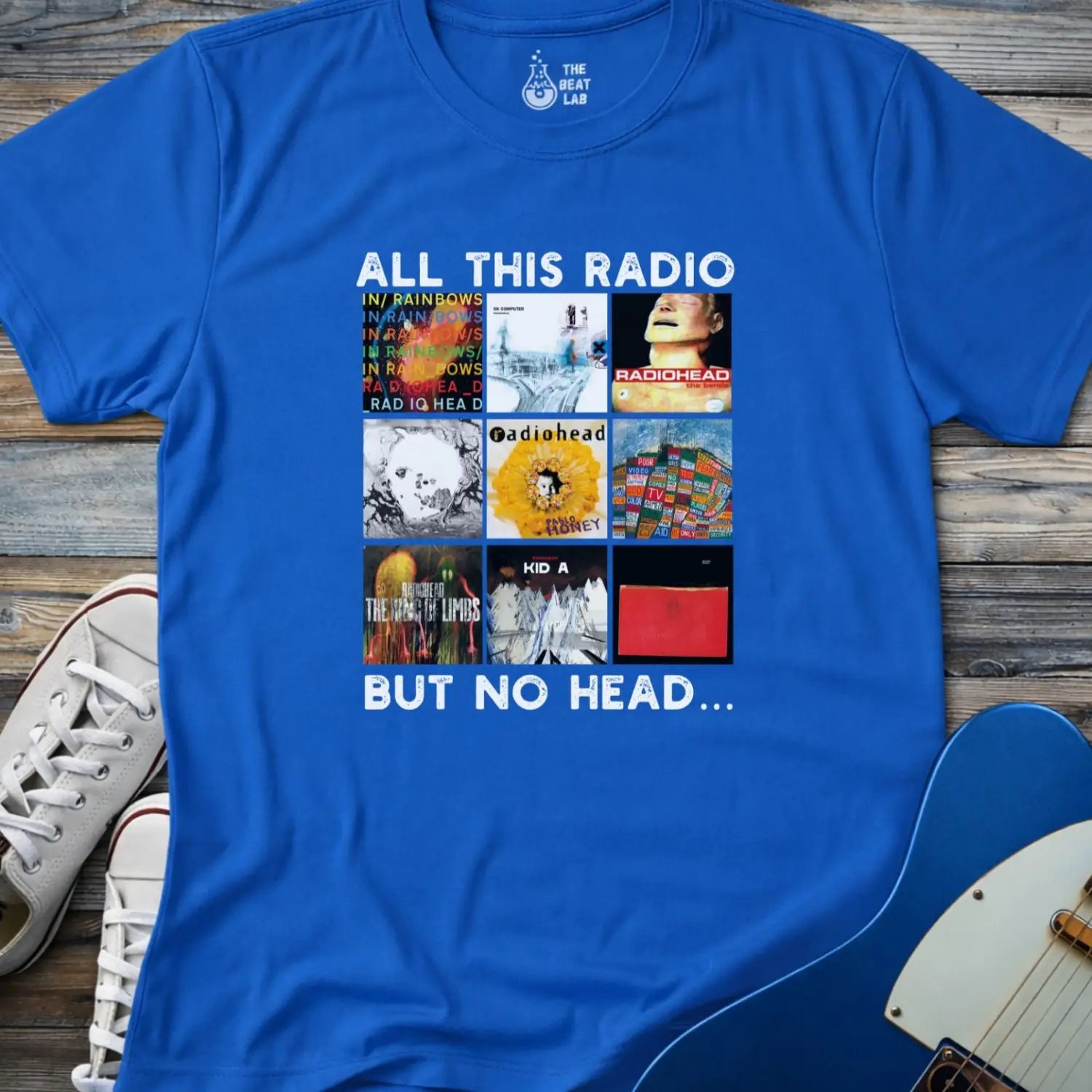 Royal blue color of adult unisex gildan 64000 shirt featuring funny radiohead rock band albums, all this radio but no head