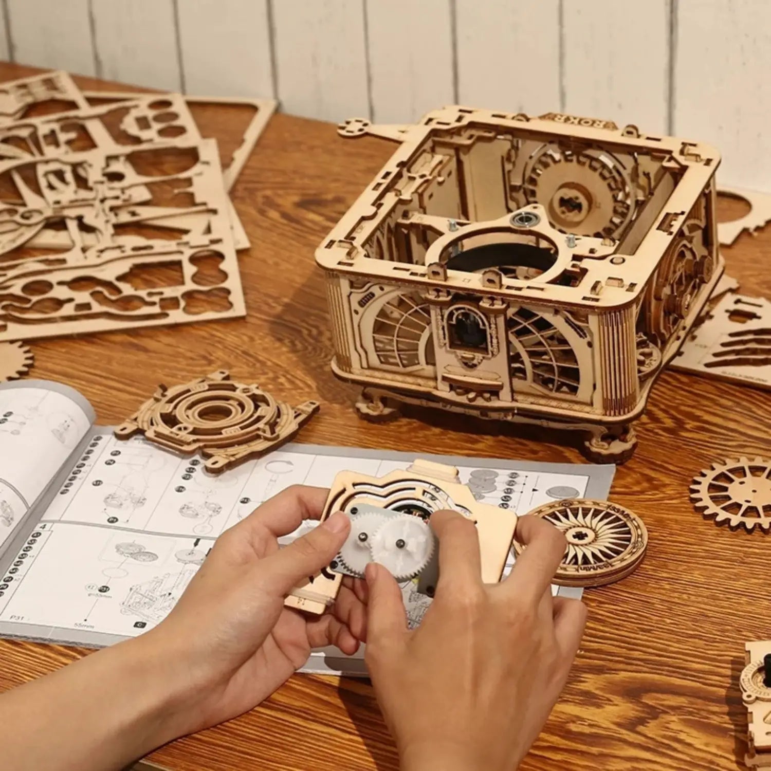 A wooden mechanical 3D puzzle in the process of being assembled.