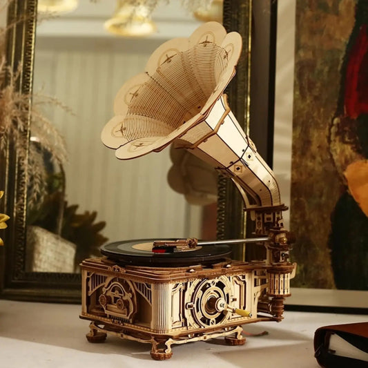 An intricate wooden model of a vintage gramophone.