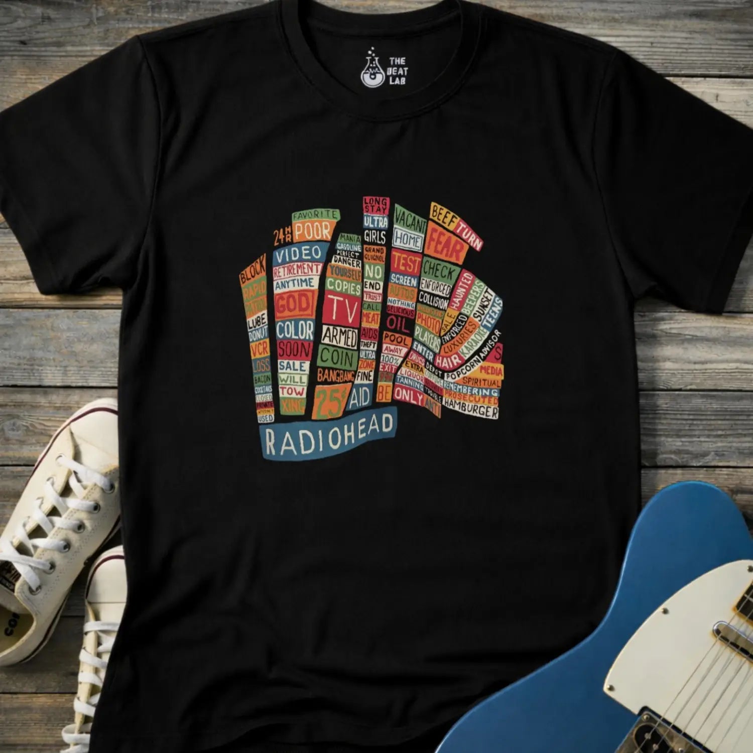 Black color adult unisex t-shirt gildan 64000 Radiohead Hail to the Thief graphic t-shirt featuring a bear-shaped block of colorful words and a RADIOHEAD label beneath.