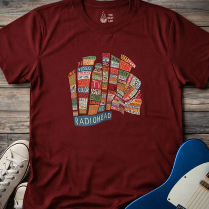 Maroon red color adult unisex t-shirt gildan 64000 Radiohead Hail to the Thief graphic t-shirt featuring a bear-shaped block of colorful words and a RADIOHEAD label beneath.