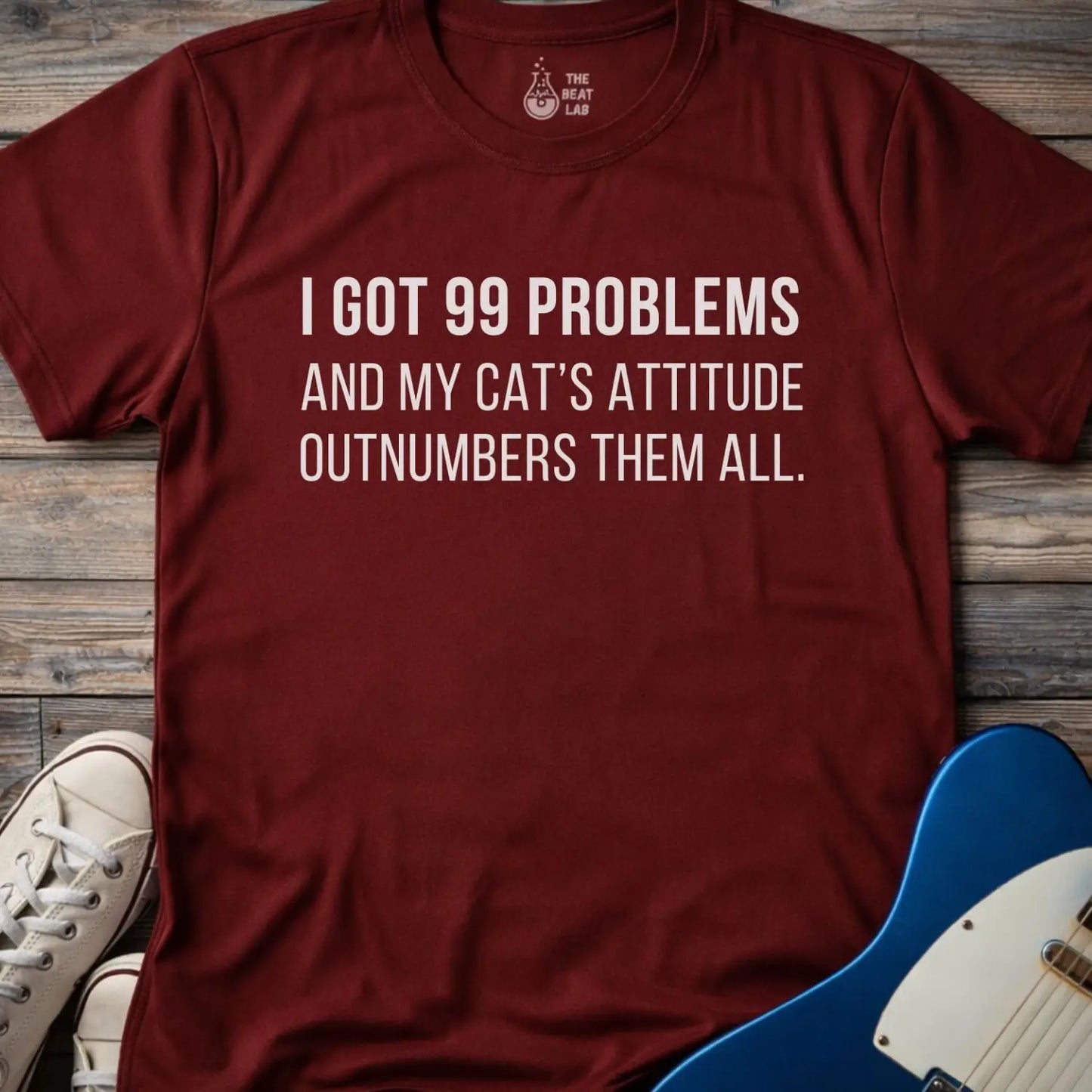 Maroon gildan 64000 unisex music shirt featuring jay z funny 99 problems graphic text "I got 99 problems and my cat’s attitude outnumbers them all".