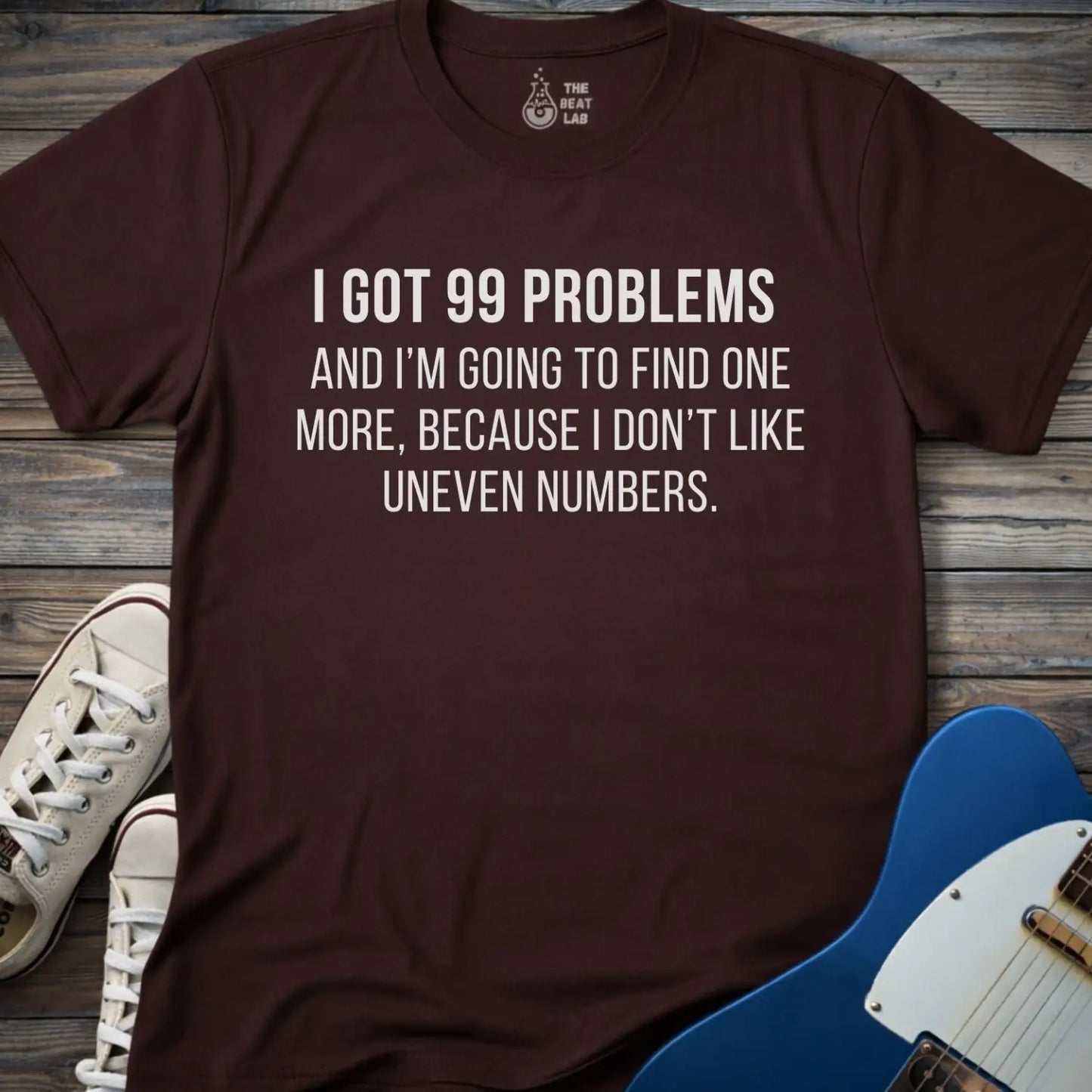 Dark chocolate gildan 64000 men women adult shirt with bold white text: “I got 99 problems and I’m going to find one more, because I don’t like uneven numbers” funny math humor design, funny Jay-z song 99 problems 