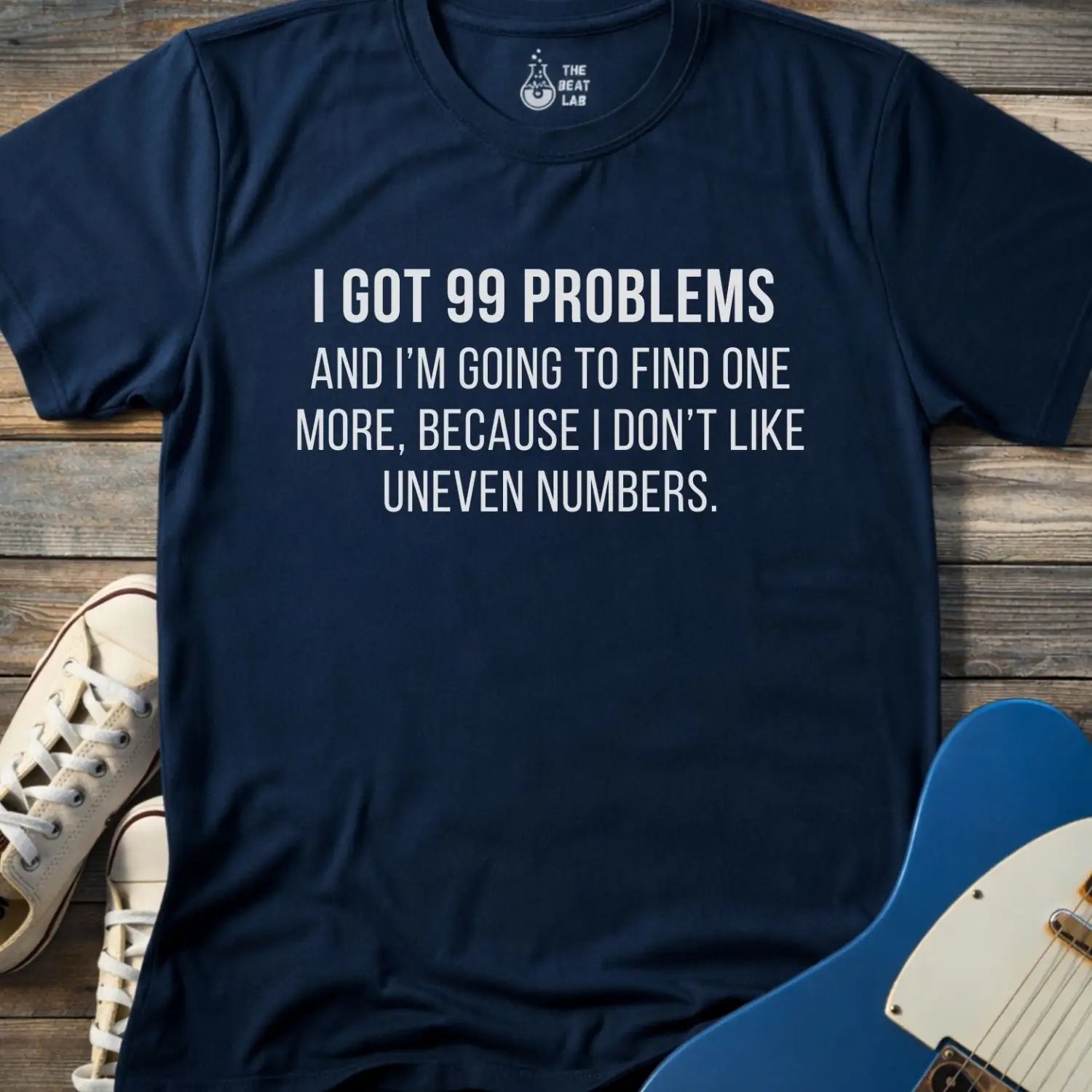 Navy blue gildan 64000 men women adult shirt with bold white text: “I got 99 problems and I’m going to find one more, because I don’t like uneven numbers” funny math humor design, funny Jay-z song 99 problems 