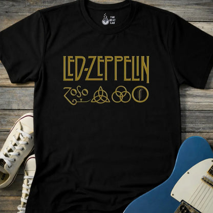 Black color adult unisex t-shirt gildan 64000 of Led Zeppelin Zoso symbols t-shirt with gold LED ZEPPELIN text and four iconic band symbols across the chest.