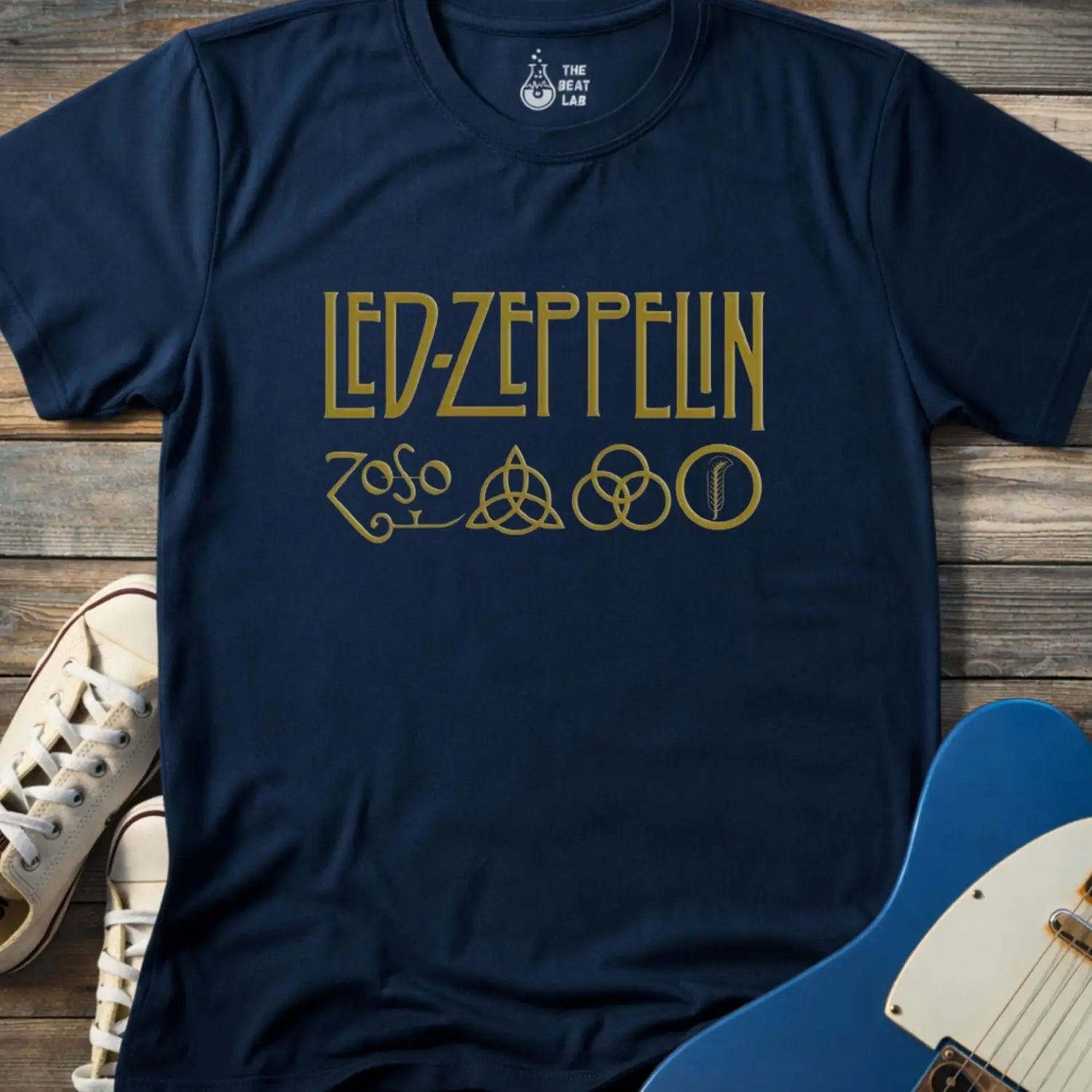 Navy blue color adult unisex t-shirt gildan 64000 of Led Zeppelin Zoso symbols t-shirt with gold LED ZEPPELIN text and four iconic band symbols across the chest.