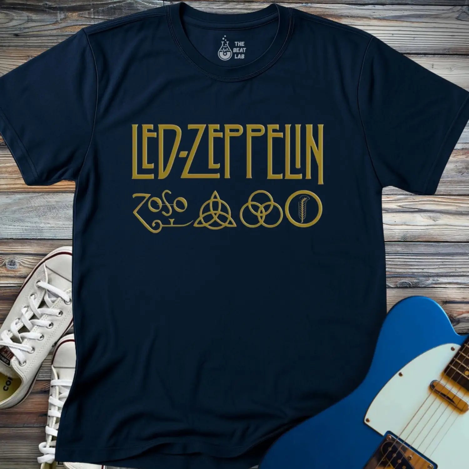 Navy blue color adult unisex t-shirt gildan 64000 of Led Zeppelin Zoso symbols t-shirt with gold LED ZEPPELIN text and four iconic band symbols across the chest.