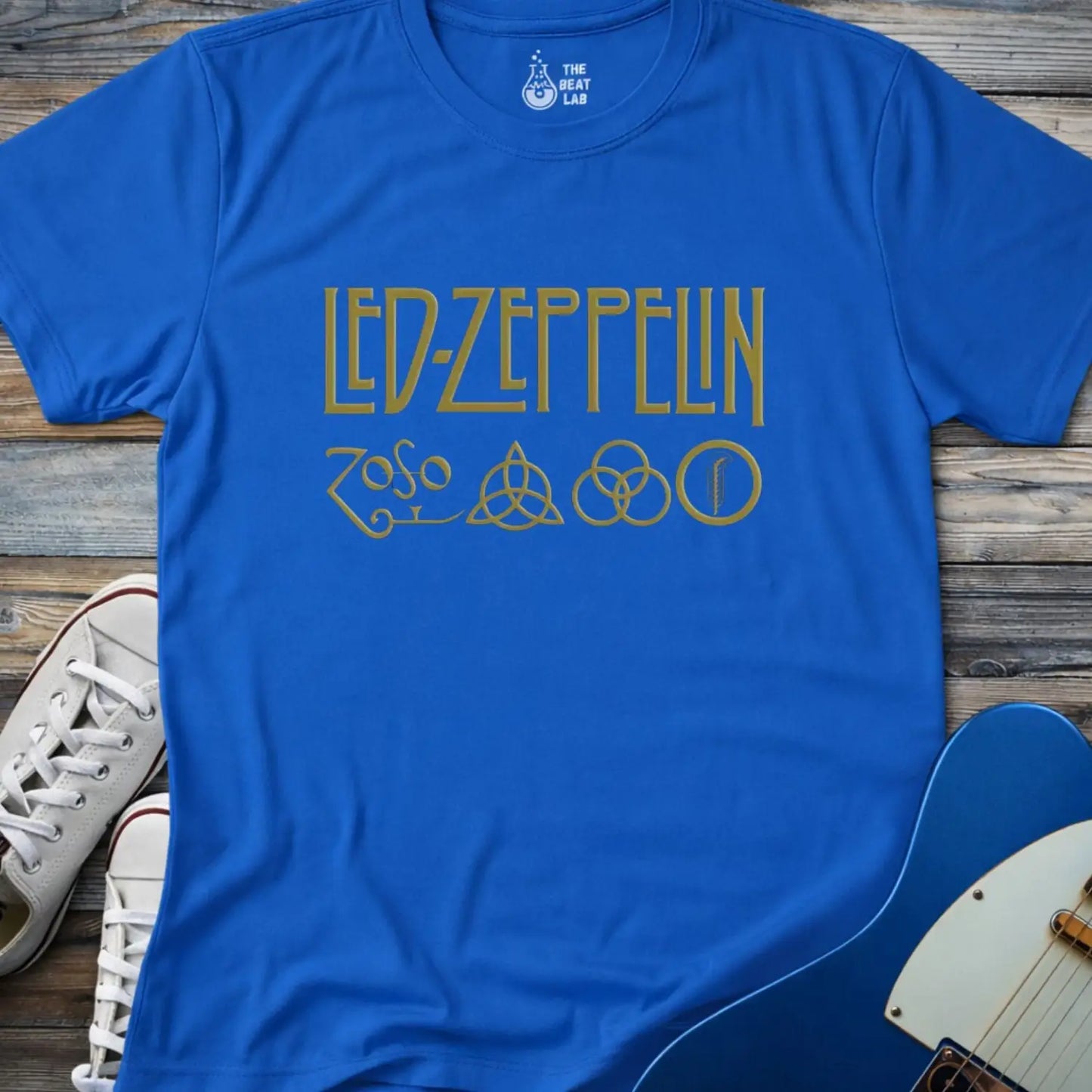 Royal blue color adult unisex t-shirt gildan 64000 of Led Zeppelin Zoso symbols t-shirt with gold LED ZEPPELIN text and four iconic band symbols across the chest.
