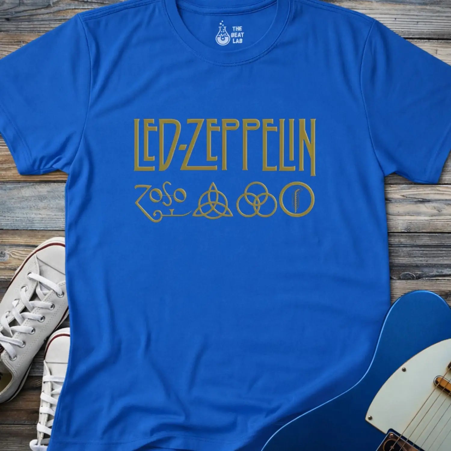 Royal blue color adult unisex t-shirt gildan 64000 of Led Zeppelin Zoso symbols t-shirt with gold LED ZEPPELIN text and four iconic band symbols across the chest.