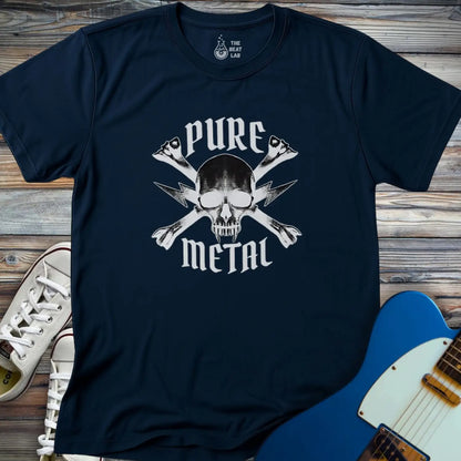 The Pure Metal T-shirt is a navy blue tee with a skull and crossbones graphic featuring crossed guitar necks and "PURE METAL" text. It's displayed on a wooden surface beside white sneakers and a blue electric guitar.