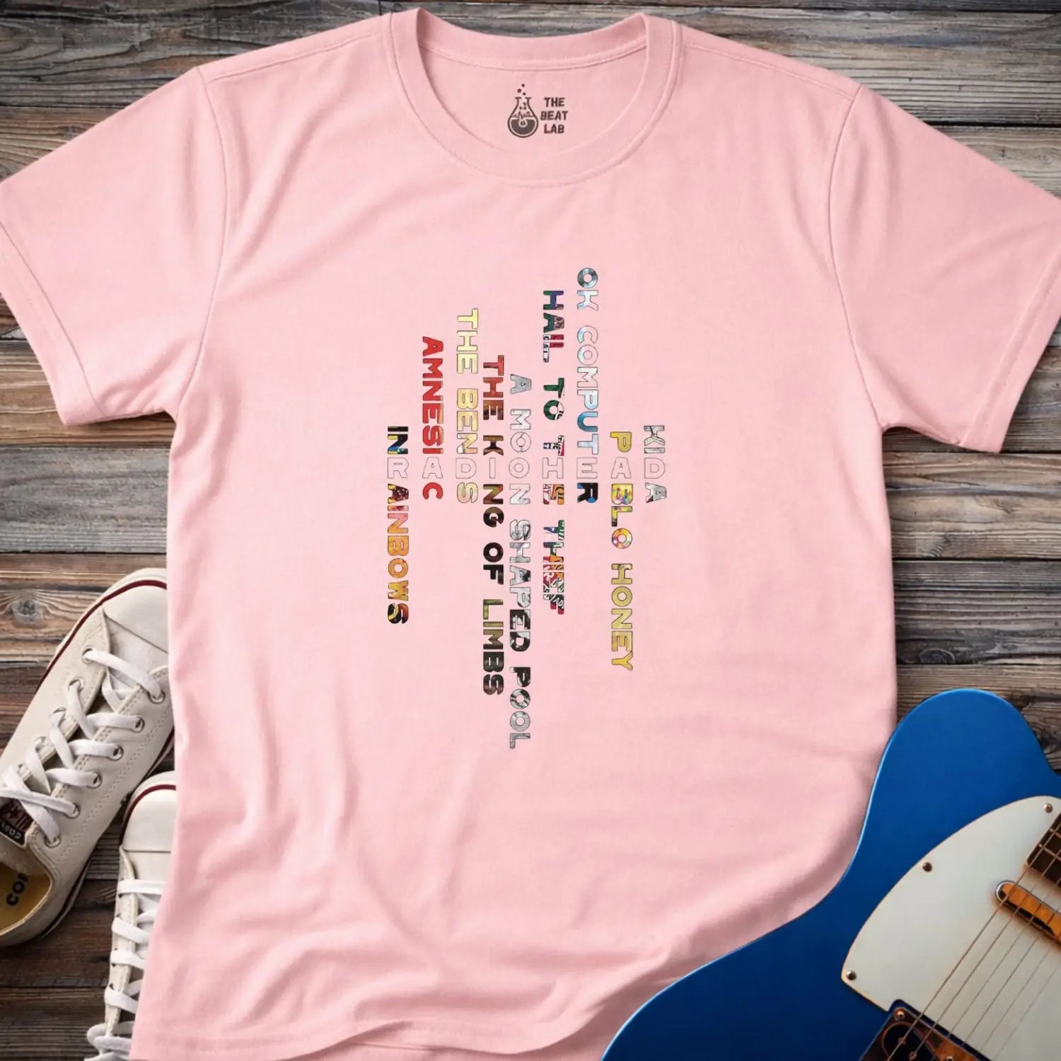 Light pink color unisex adult shirt featuring Radiohead rock band Albums collage