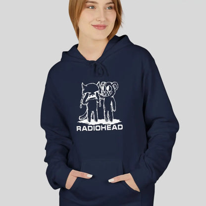 Woman wearing pullover gildan hoodie with white bear character artwork graphic and “Radiohead” text design.