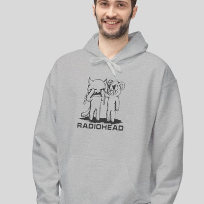 Man wearing pullover gildan hoodie with white bear character artwork graphic and “Radiohead” text design.