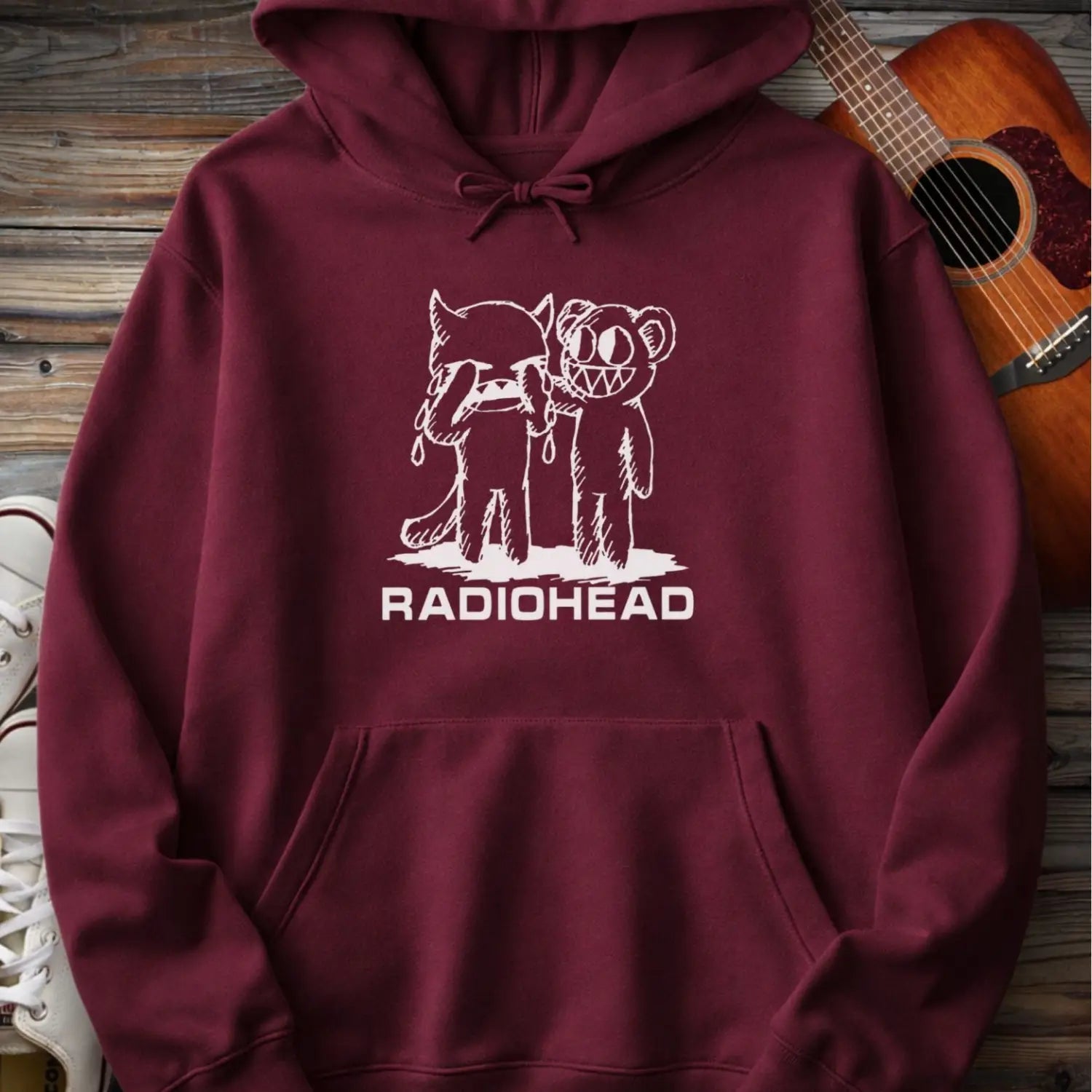 Maroon red men women pullover gildan hoodie with white bear character artwork graphic and “Radiohead” text design.