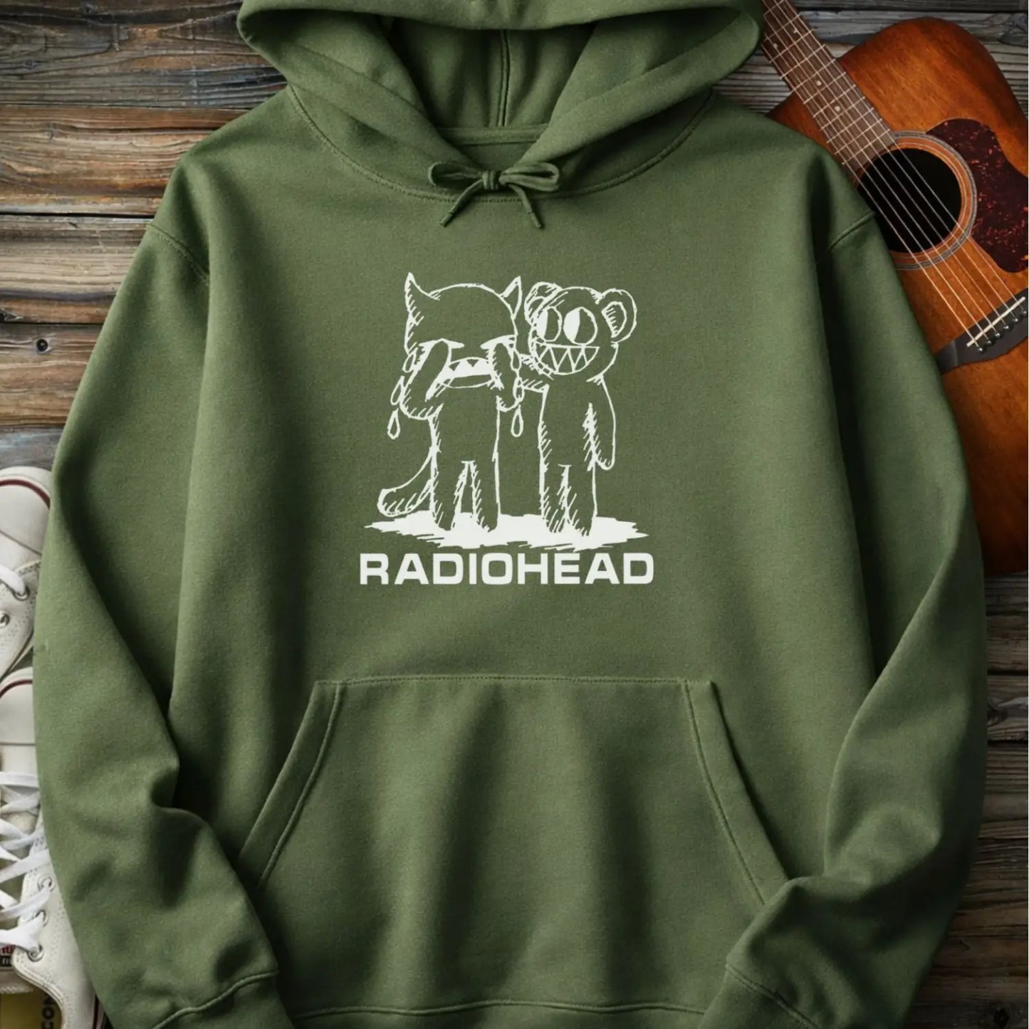 Military green men women pullover gildan hoodie with white bear character artwork graphic and “Radiohead” text design.