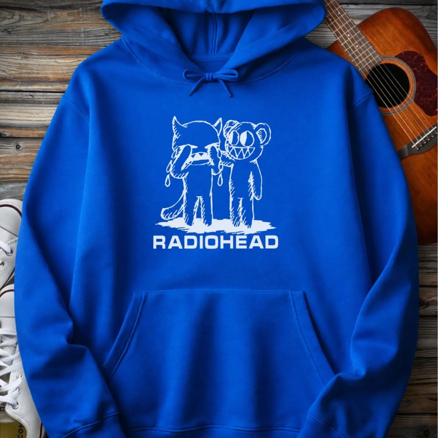 Royal blue men women pullover gildan hoodie with white bear character artwork graphic and “Radiohead” text design.
