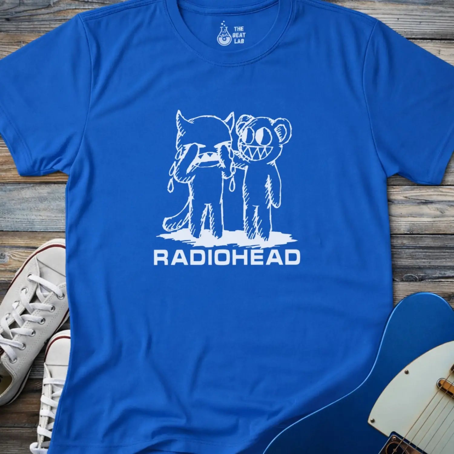 Royal blue color of adult men women gildan 64000 shirt featuring radiohead bear artwork sketch, vintage metal bandwear tee