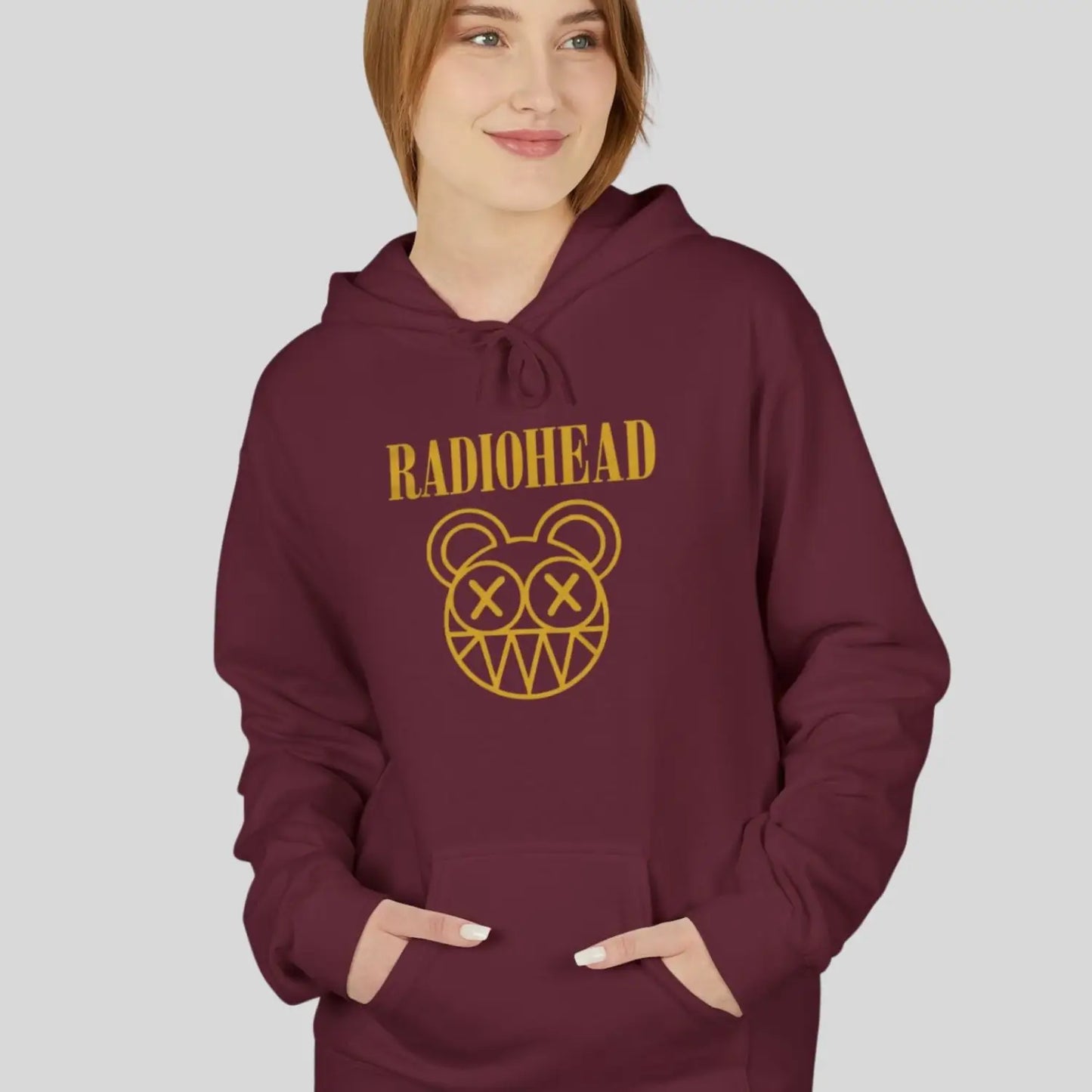 Woman wearing maroon color of adult pullover fleece Gildan hoodie featuring vintage radiohead rock band music logo