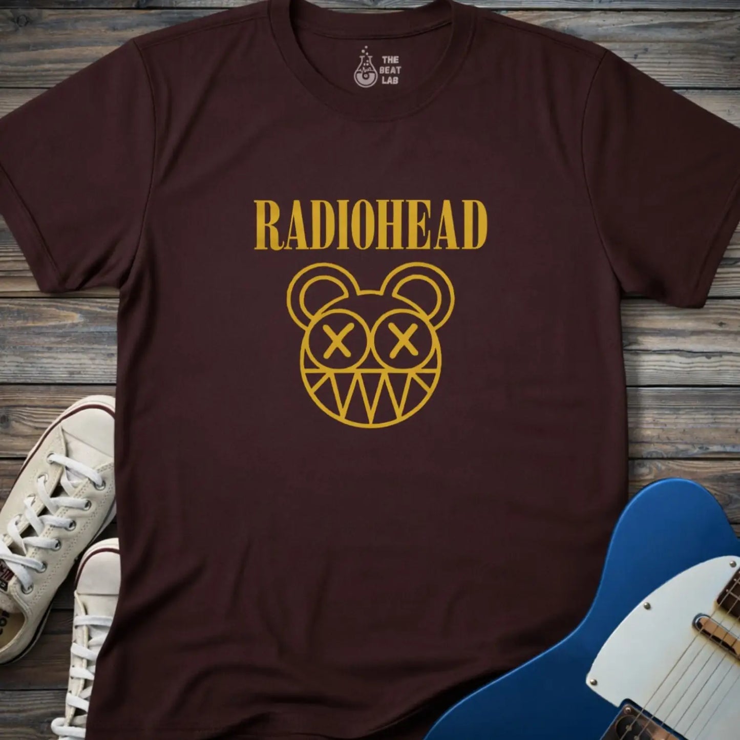 Dark chocolate adult unisex Radiohead band logo gildan 64000 t-shirt with clean rock typography centered on the chest for minimalist music merch style