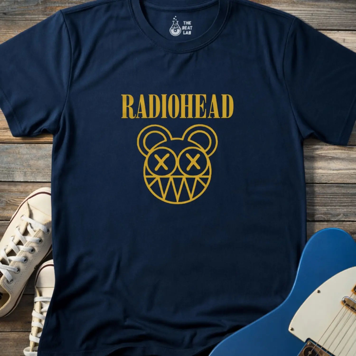Navy blue adult unisex Radiohead band logo gildan 64000 t-shirt with clean rock typography centered on the chest for minimalist music merch style