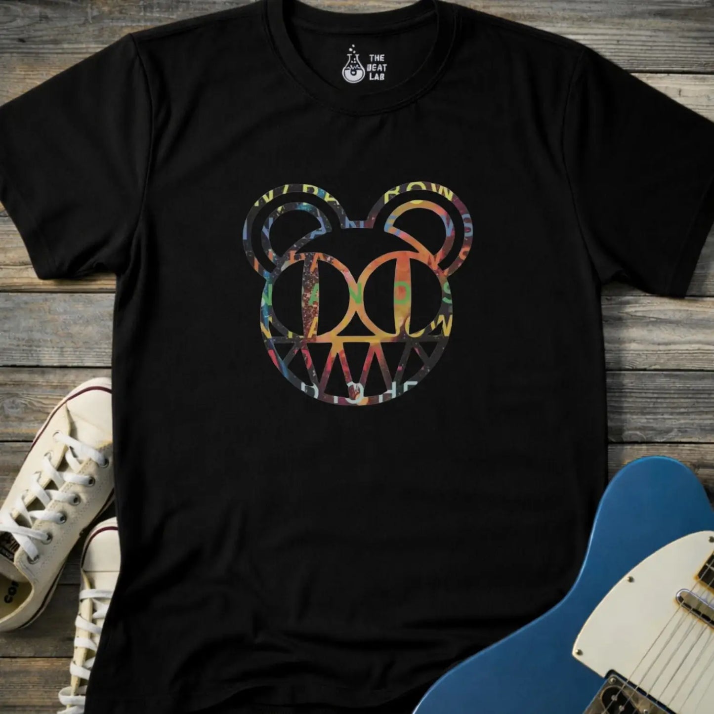 Black unisex color Radiohead bear logo collage t-shirt with the iconic cartoon bear head combined with colorful album-inspired artwork for rock fans.