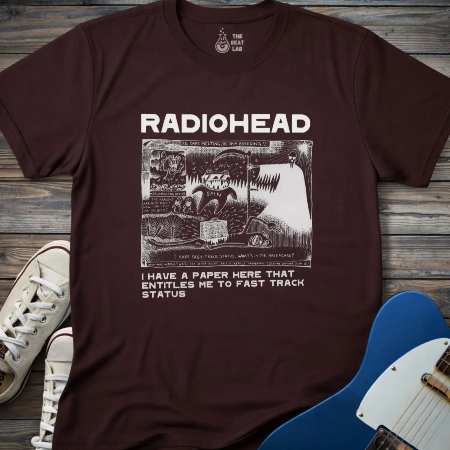 Dark chocolate color of adult women men gildan 64000 shirt featuring radiohead fast track comic art, vintage bandwear music shirt