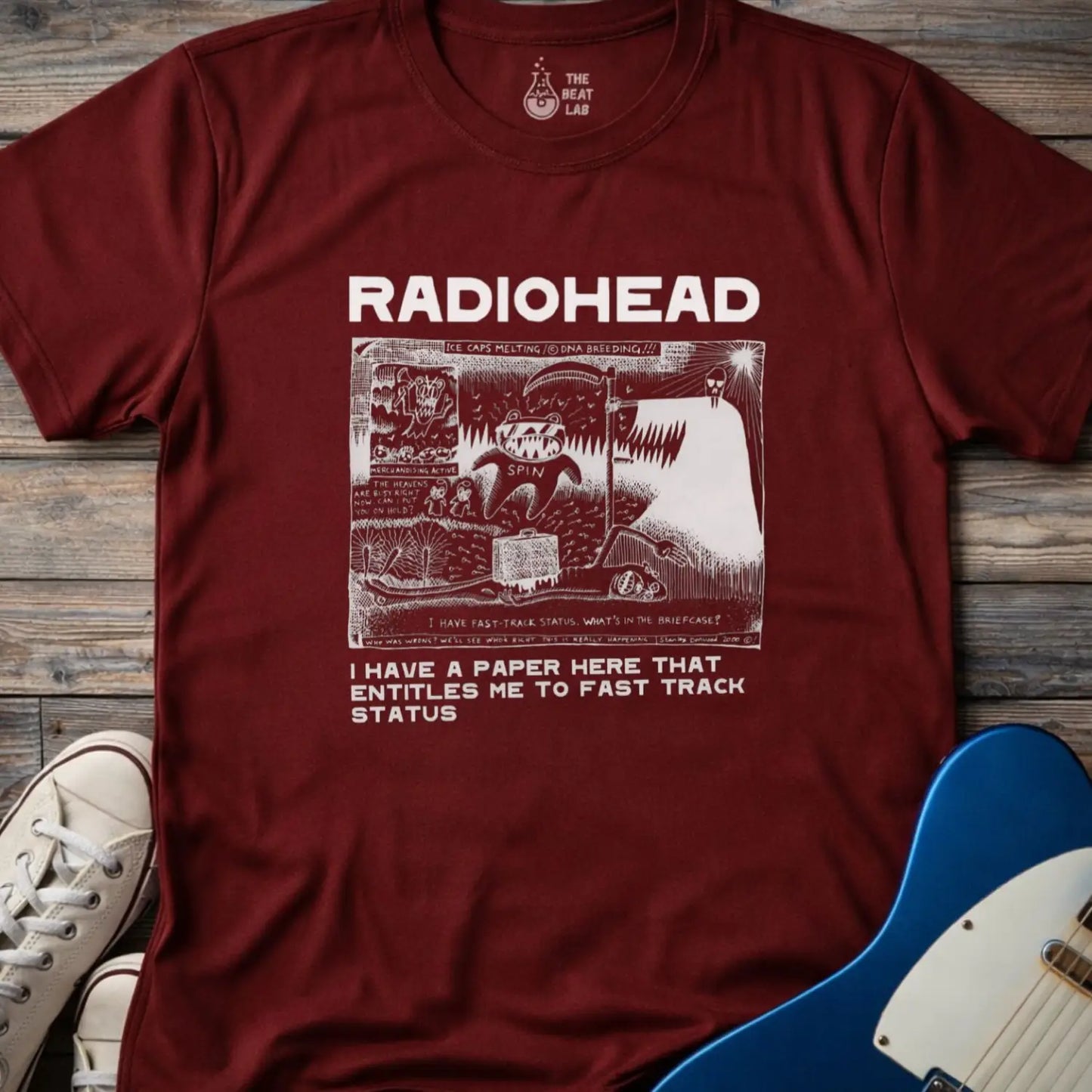 Maroon color of adult women men gildan 64000 shirt featuring radiohead fast track comic art, vintage bandwear music shirt