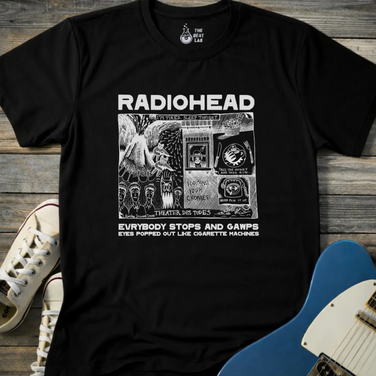 Black adult men women unisex shirt featuring Radiohead comic art everybody stops and gawps eyes popped out like cigarette machines, vintage band music shirt