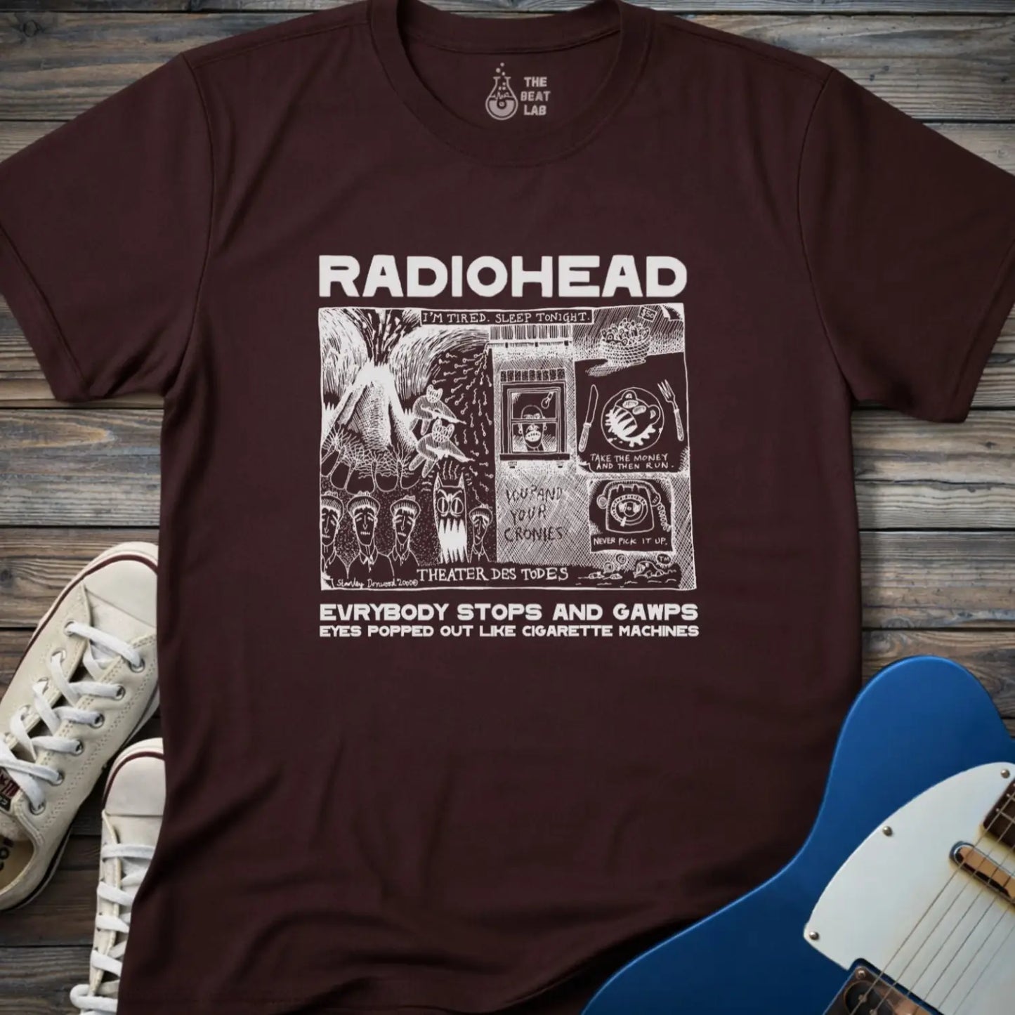 Dark chocolate adult men women unisex shirt featuring Radiohead comic art everybody stops and gawps eyes popped out like cigarette machines, vintage band music shirt