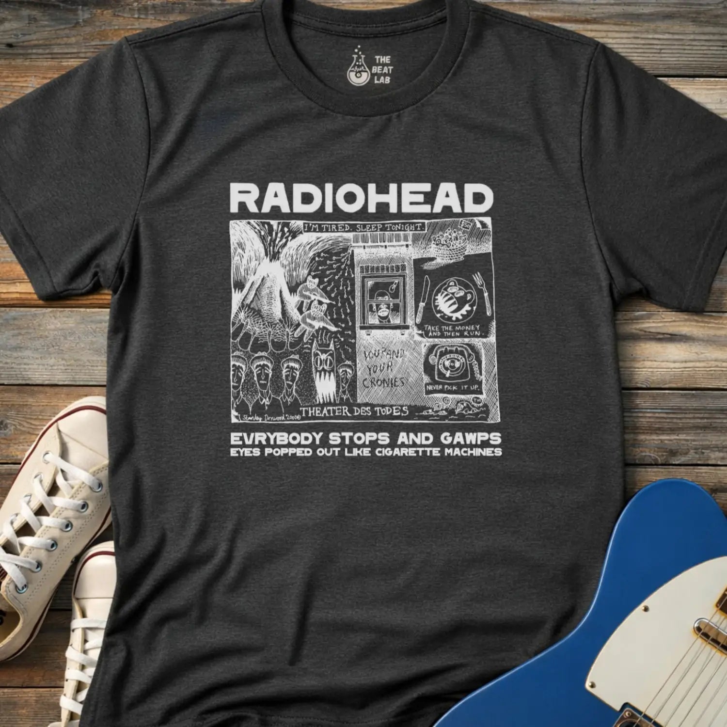 Dark heather grey adult men women unisex shirt featuring Radiohead comic art everybody stops and gawps eyes popped out like cigarette machines, vintage band music shirt