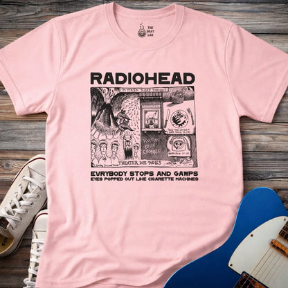 Light pink adult men women unisex shirt featuring Radiohead comic art everybody stops and gawps eyes popped out like cigarette machines, vintage band music shirt