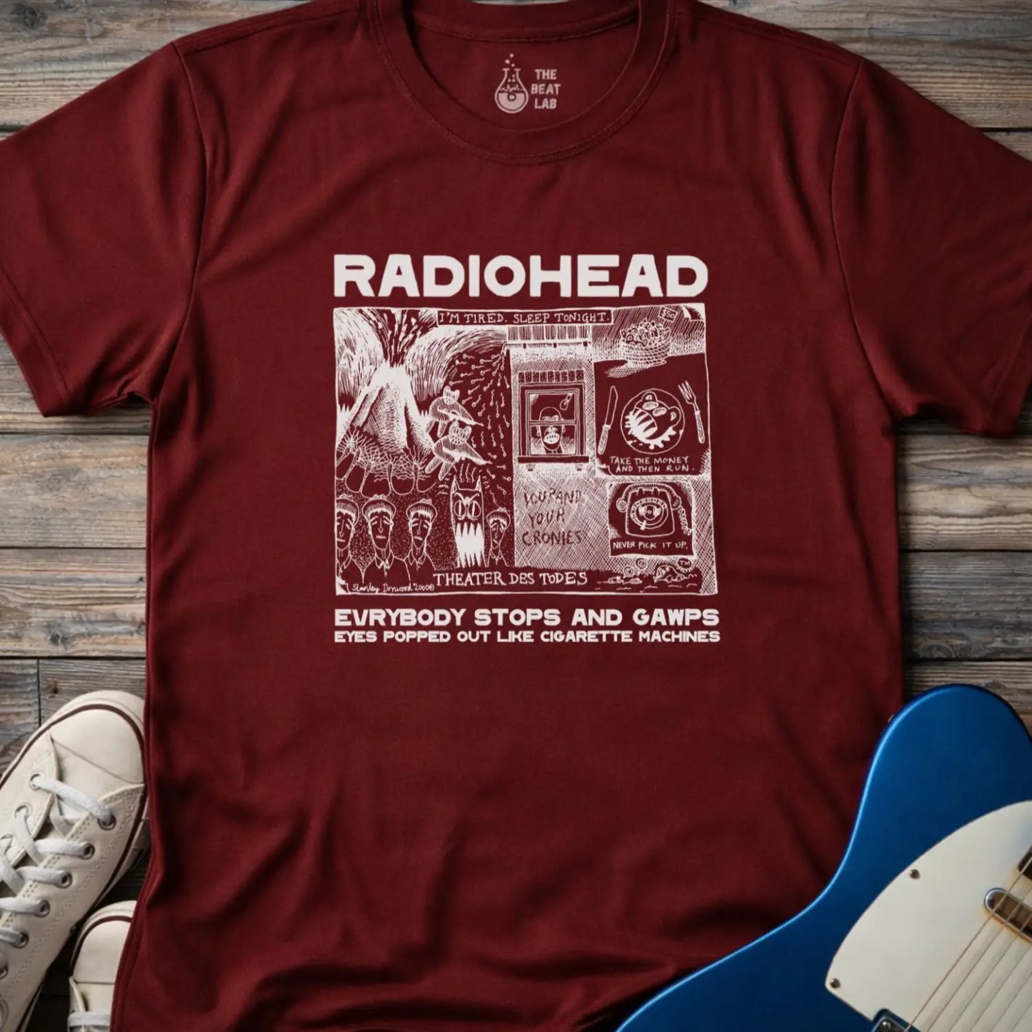 Maroon red adult men women unisex shirt featuring Radiohead comic art everybody stops and gawps eyes popped out like cigarette machines, vintage band music shirt