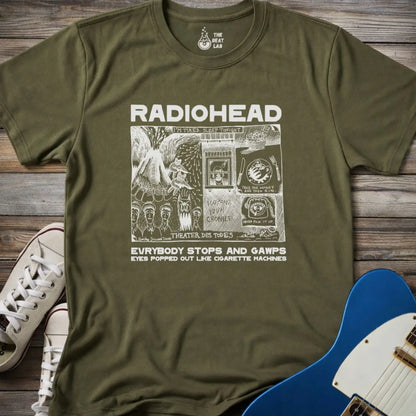 Military green adult men women unisex shirt featuring Radiohead comic art everybody stops and gawps eyes popped out like cigarette machines, vintage band music shirt