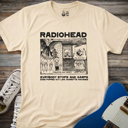 Sand beige adult men women unisex shirt featuring Radiohead comic art everybody stops and gawps eyes popped out like cigarette machines, vintage band music shirt