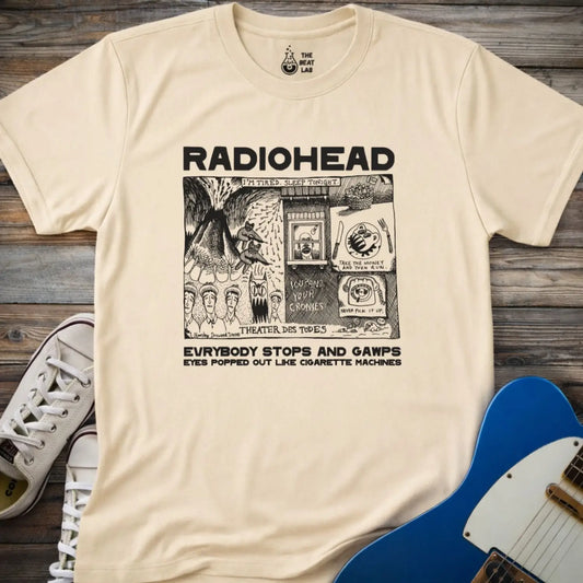 Sand beige adult men women unisex shirt featuring Radiohead comic art everybody stops and gawps eyes popped out like cigarette machines, vintage band music shirt