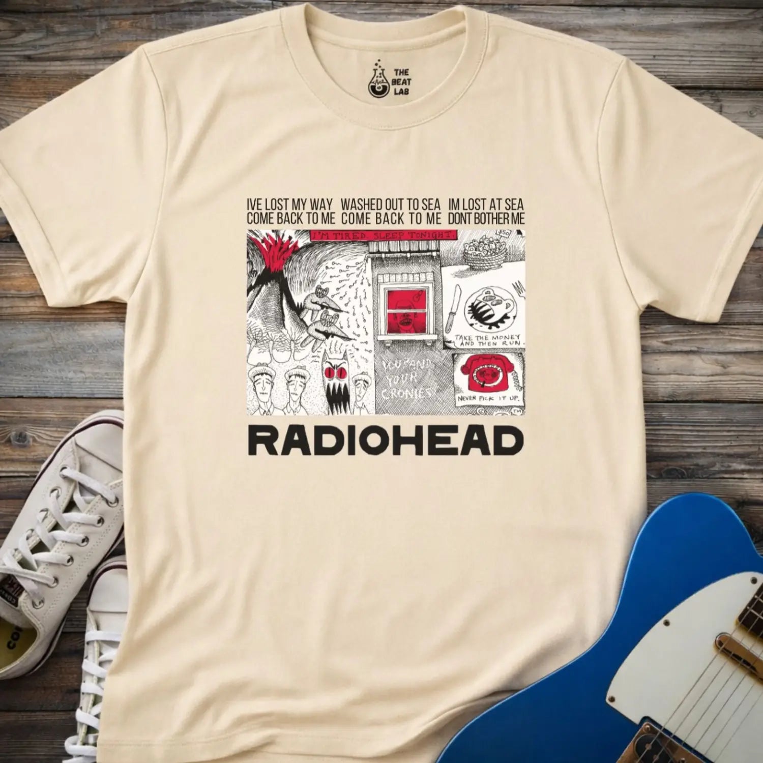 Sand beige adult unisex gildan 64000 shirt featuring radiohead band metal, comic art music t-shirt