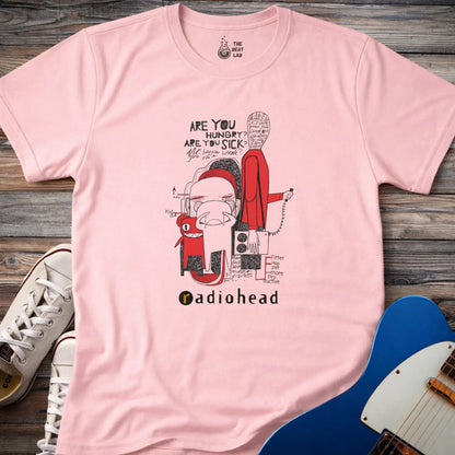 Light pink color adult unisex t-shirt gildan 64000  Radiohead comic sketch t-shirt with abstract cartoon figures in red/black line art and ‘Are you hungry? Are you sick?’ text above stylized band name.