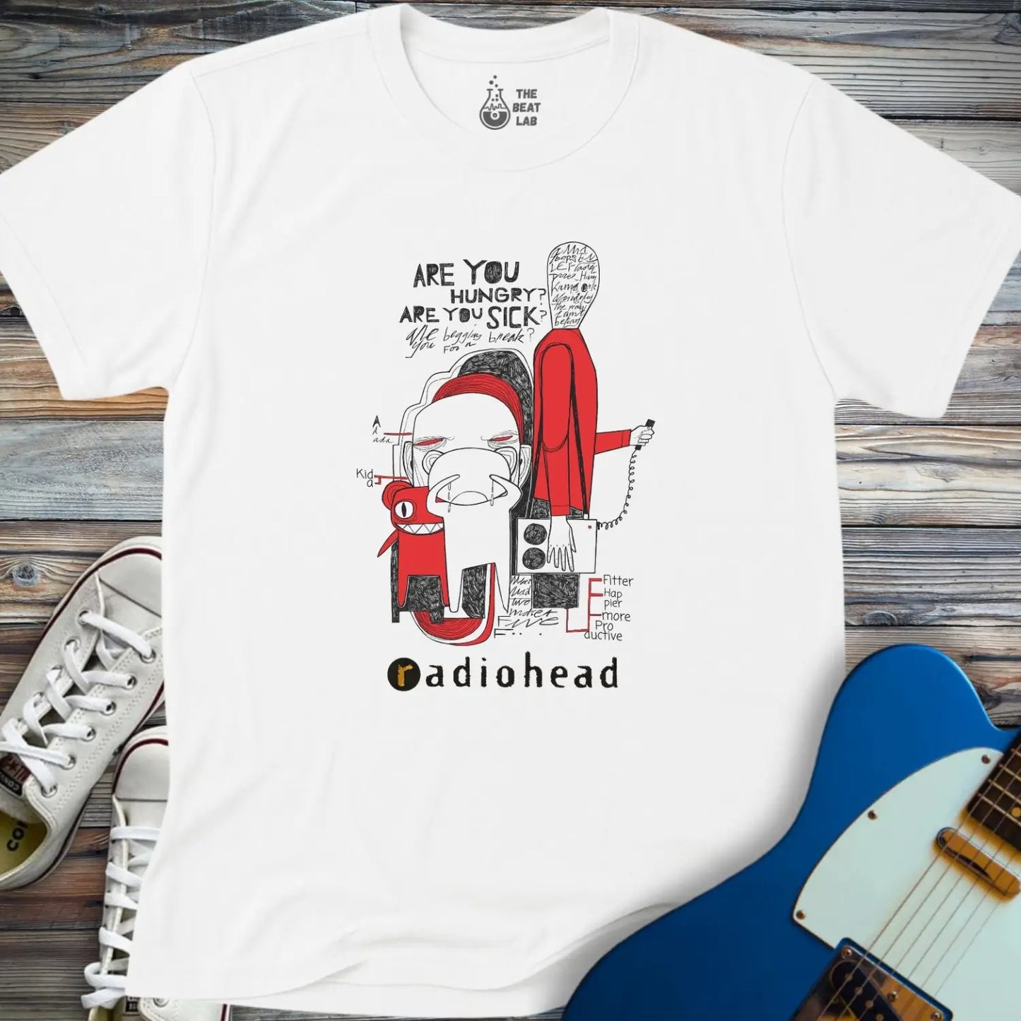 White color adult unisex t-shirt gildan 64000  Radiohead comic sketch t-shirt with abstract cartoon figures in red/black line art and ‘Are you hungry? Are you sick?’ text above stylized band name.
