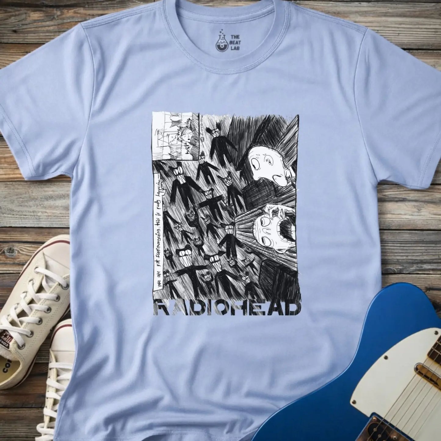 Light blue shirt with black and white graphic design and 'Radiohead' text, classic vintage metal band shirt