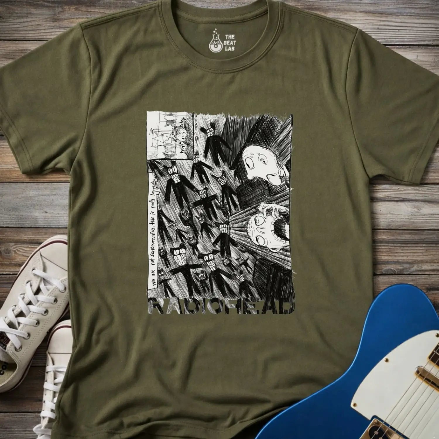 Military green shirt with black and white graphic design and 'Radiohead' text, classic vintage metal band shirt