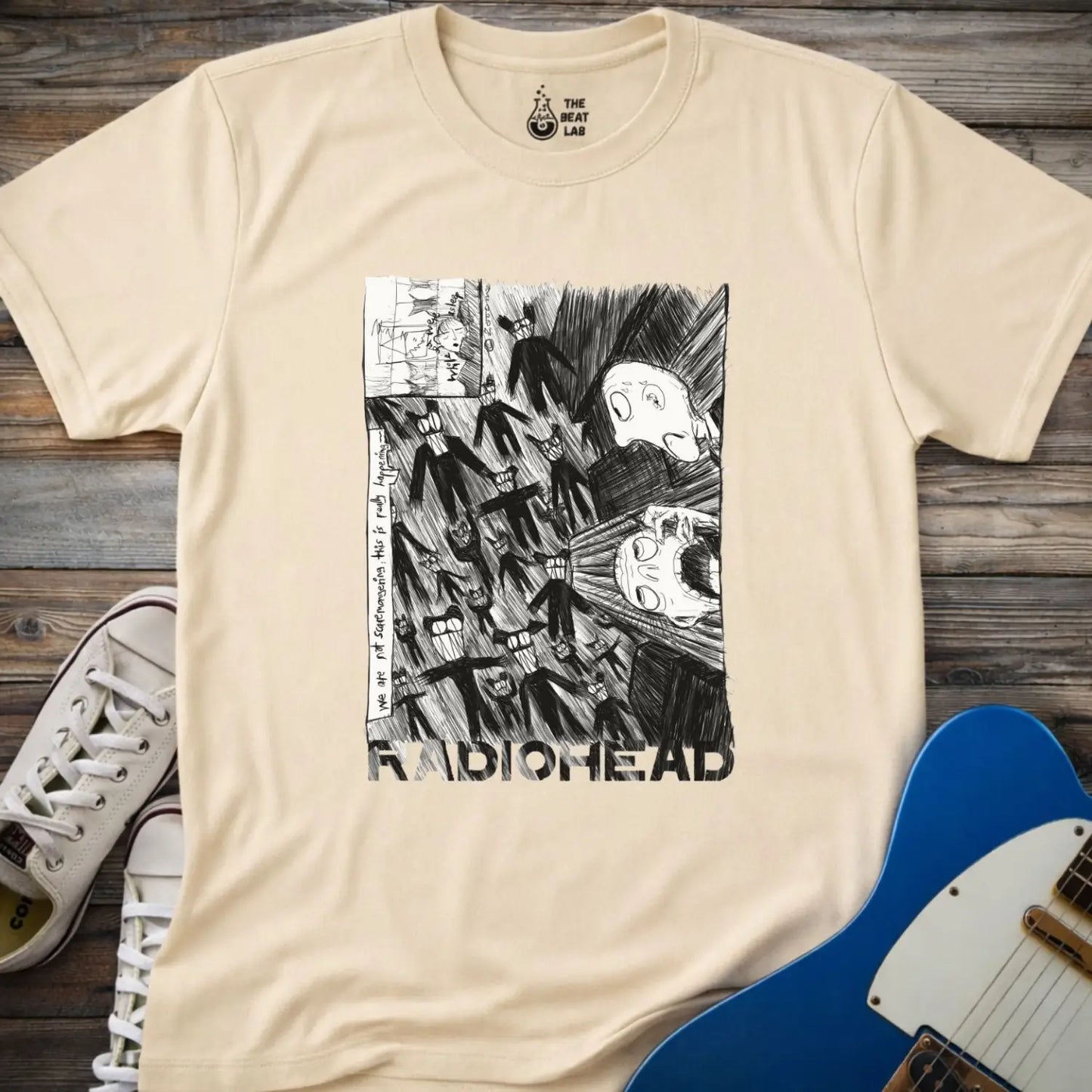 Sand beige shirt with black and white graphic design and 'Radiohead' text, classic vintage metal band shirt