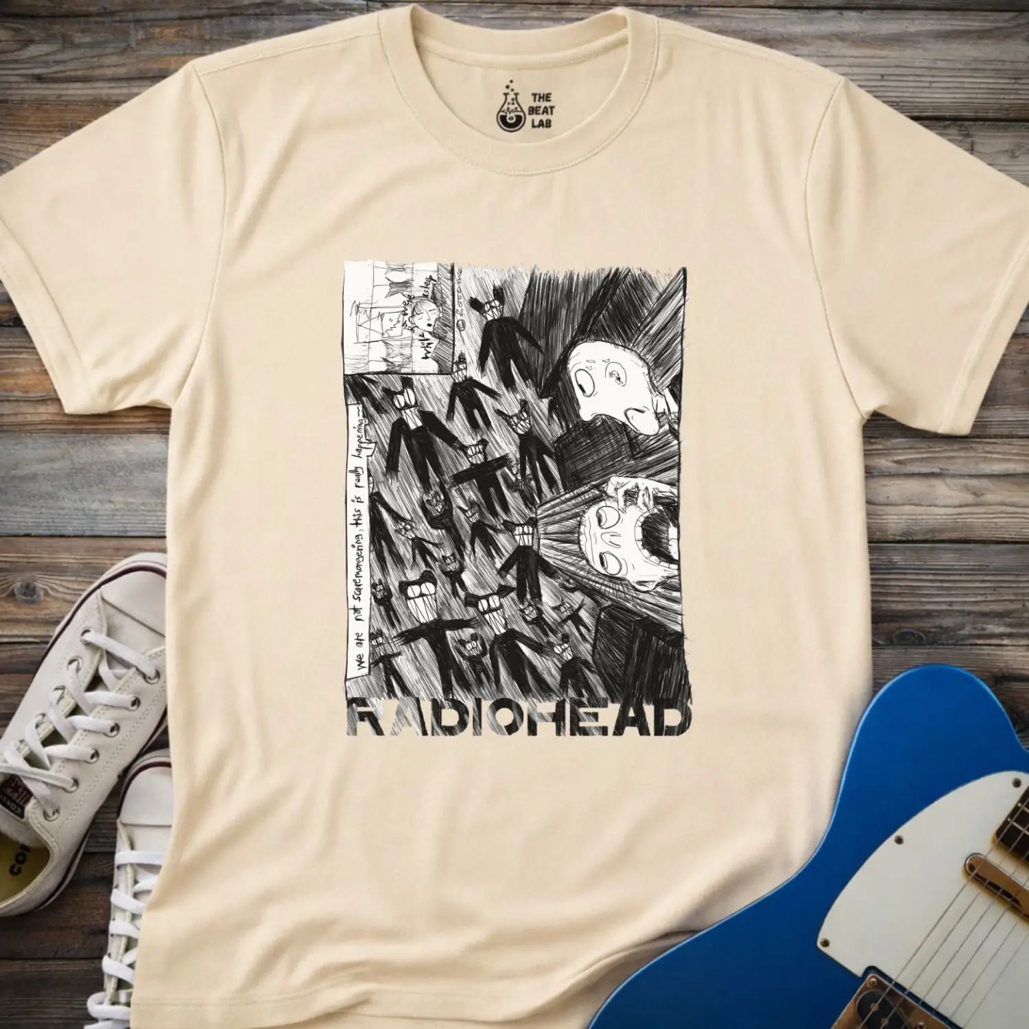 Sand beige shirt with black and white graphic design and 'Radiohead' text, classic vintage metal band shirt