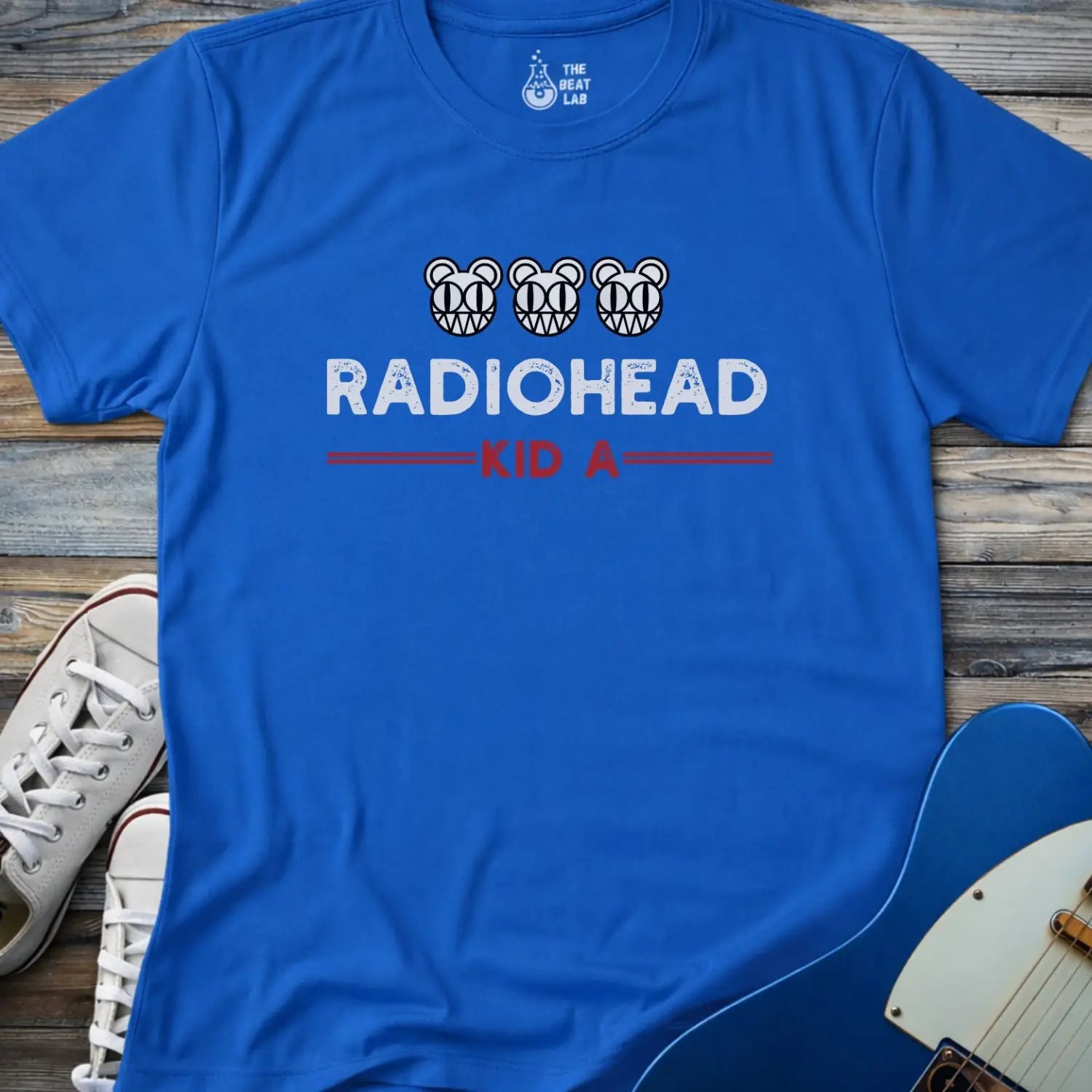 Royal blue color of adult men women gildan 64000 shirt featuring radiohead kid a album, vintage band music tee