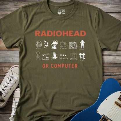 Military Green color adult unisex t-shirt gildan 64000 Radiohead OK Computer graphic t-shirt with large RADIOHEAD and OK COMPUTER text and a horizontal row of minimalist white icons in between.