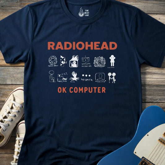Navy blue color adult unisex t-shirt gildan 64000 Radiohead OK Computer graphic t-shirt with large RADIOHEAD and OK COMPUTER text and a horizontal row of minimalist white icons in between.